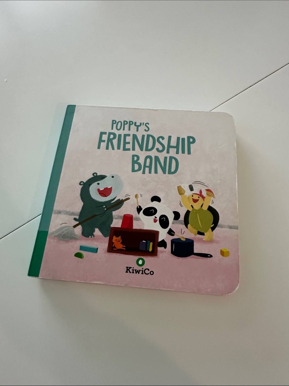 KiwiCo Poppy's Friendship Band Kids Board Book - Pink/Teal